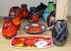 A collection of modern Poole Pottery, including five small Volcano vases, a Volcano pin dish, a