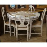 A white painted bamboo effect circular topped dining table and four chairs table W.110cm