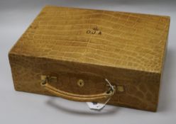 A Goldsmiths & Silversmiths Co. Ltd crocodile skin jewellery case, early 20th century, fitted