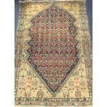 A Caucasian red, blue and cream ground rug 190 x 130cm.