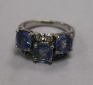 An 18ct gold and graduated princess cut diamond half hoop ring, set with thirteen stones, size S.