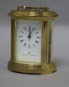 An oval gilt brass-cased carriage clock, having white Roman dial signed Matthew Norman, H 12.5cm