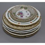 A collection of decorative plates, including a Derby plate, ten flower-decorated plates and six
