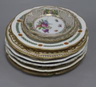 A collection of decorative plates, including a Derby plate, ten flower-decorated plates and six