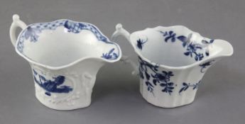 Two Worcester blue and white creamboats in the Bare Tree Pagoda and Prunus Root patterns, c.1754-60,