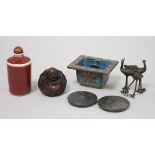 A bag of small items: Chinese cloisonne incense burner, two bronze mirrors, a porcelain snuff