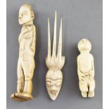 Two West African ivory storyteller figures, c.1900 and a hair ornament carved with a mask, largest