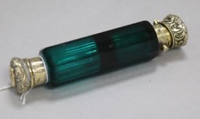 A Victorian silver gilt mounted green glass double-ended scent bottle.