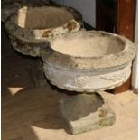 Two reconstituted stone pedestal campana urn shape planters W.46cm approx.