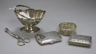 An Edwardian silver sugar basket, a later silver cigarette case, a pair of Britannia standard silver