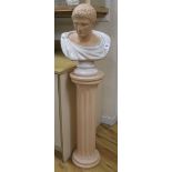 A terracotta and white marble effect bust of a Roman Emperor, raised on a plinth