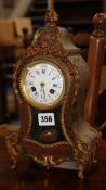 An early 20th century red boullework mantel clock, with enamelled dial signed Leroy à Paris 30cm