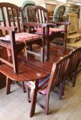 A teak folding garden table and six chairs W.166cm