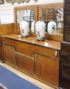 A 1970's Italian burr walnut side cabinet and a pair of matching wall mirrors W.182cm.