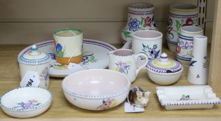 Twelve items of traditional floral-decorated Poole pottery and two other items, comprising a Poole