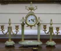 An early 20th century ormolu mounted green onyx clock garniture, the clock signed Galier Rouen clock