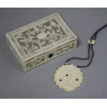 A Chinese Ivory box and an ivory pendant