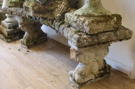 A reconstituted stone shaped garden bench W.108cm