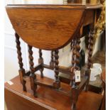 A small oak gateleg table W.61cm