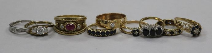 Nine assorted 9ct gold and gem set dress rings.