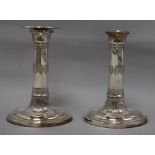 A pair of George III style plated candlesticks height 16cm