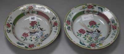 A pair of Chinese export famille rose 'pheasant' plates diameter 23cm