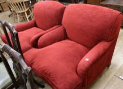 A near pair of red chenille Victorian armchairs