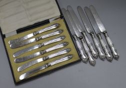 A set of George V silver tea knives and 6 silver dessert knives.