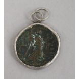 A Roman bronze coin, possibly Maximianus, in white metal pendant mount with suspension loop, Dia