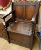 An oak box seat monks bench W.69cm