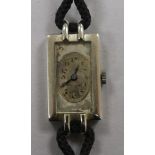 A lady's 18ct white gold Rolex rectangular dial manual wind wrist watch.