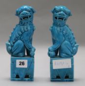 A pair of turquoise dogs of fo height 20cm (some damage)