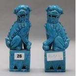 A pair of turquoise dogs of fo height 20cm (some damage)