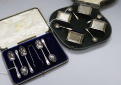 A set of four silver salts and spoons, blue glass liners, cased and a part set of teaspoons and