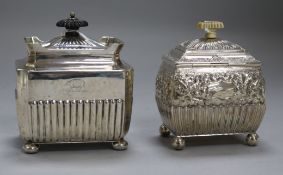 Two late Victorian silver tea caddies, of shaped rectangular form with hinged covers, crested, one