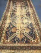 A Caucasian cream and blue ground carpet 390 x 190cm.