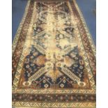 A Caucasian cream and blue ground carpet 390 x 190cm.