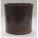 A large Chinese hardwood brushpot, with pierced circular hole to the base, height 23cm