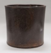 A large Chinese hardwood brushpot, with pierced circular hole to the base, height 23cm