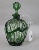 A Stevens & Williams clear and green cagework glass jug and stopper, registered design number for