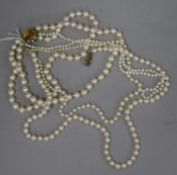 Four assorted cultured pearl necklaces including double strand with 9ct gold clasp.