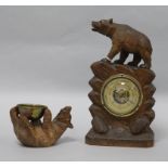 A Black Forest barometer and another carving barometer height 23cm