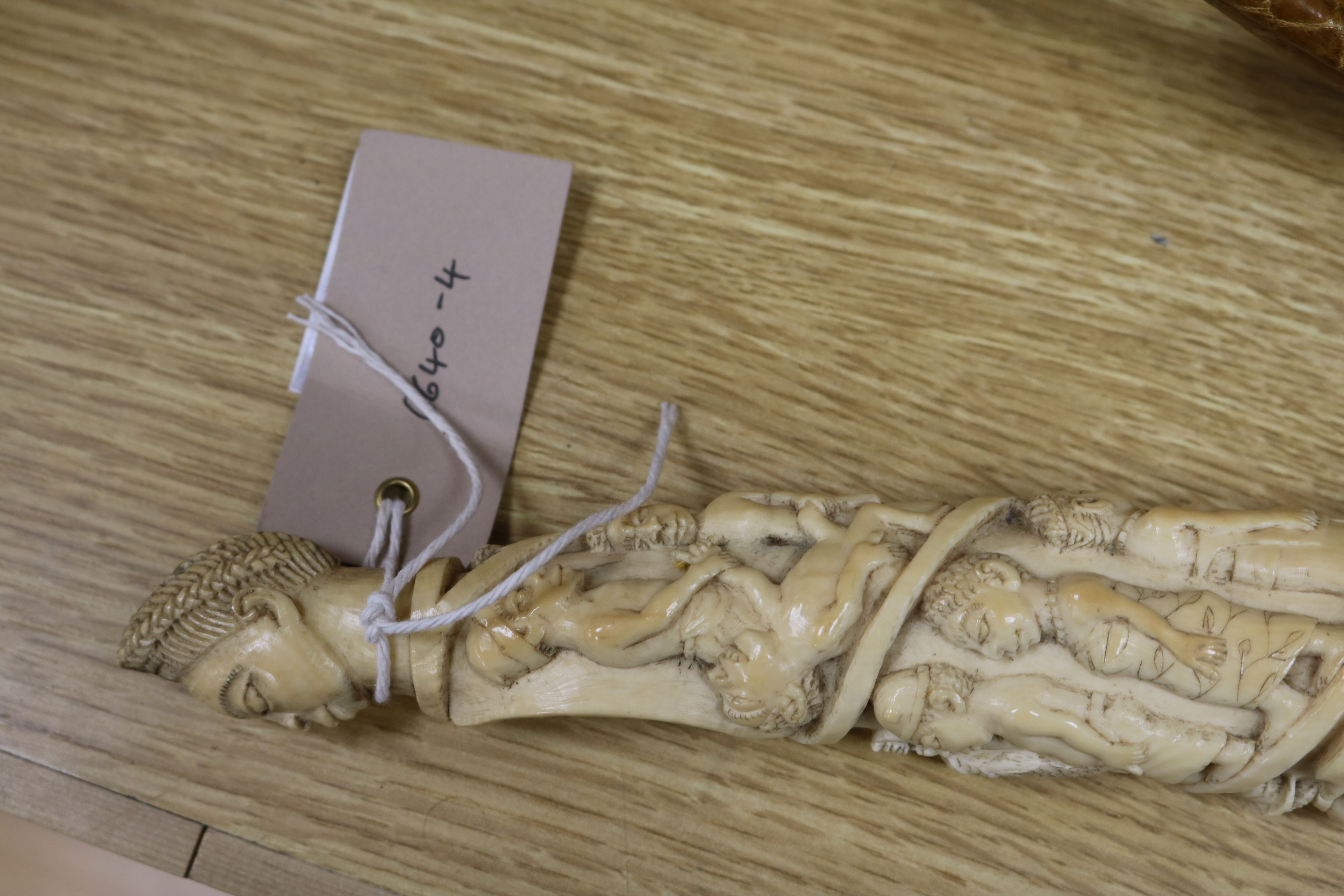 A Belgian Congo ivory oliphant, c.1900, carved with a procession of figures, hammerhead shark - Image 8 of 9