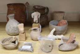 A collection of pottery artefacts, possibly Roman, Pre-Columbian and other, including three oil