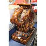 A Chinese brown glazed elephant garden seat height 56cm width 54cm