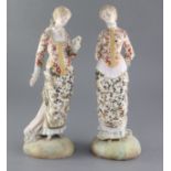 Two French painted biscuit porcelain figures of elegant ladies, late 19th century, on circular