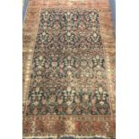 A North West Persian rust ground rug approx. 200 x 130cm.