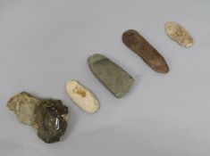 A prehistoric polished grey flint axe head, L 11cm and four other items, including a large Acheulian