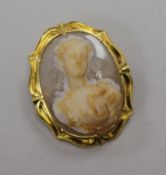 An early 20th century yellow metal mounted oval hardstone cameo, carved with the bust of