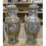 A pair of large 19th century Chinese famille rose vases and cover, 67.5cm high, repaired